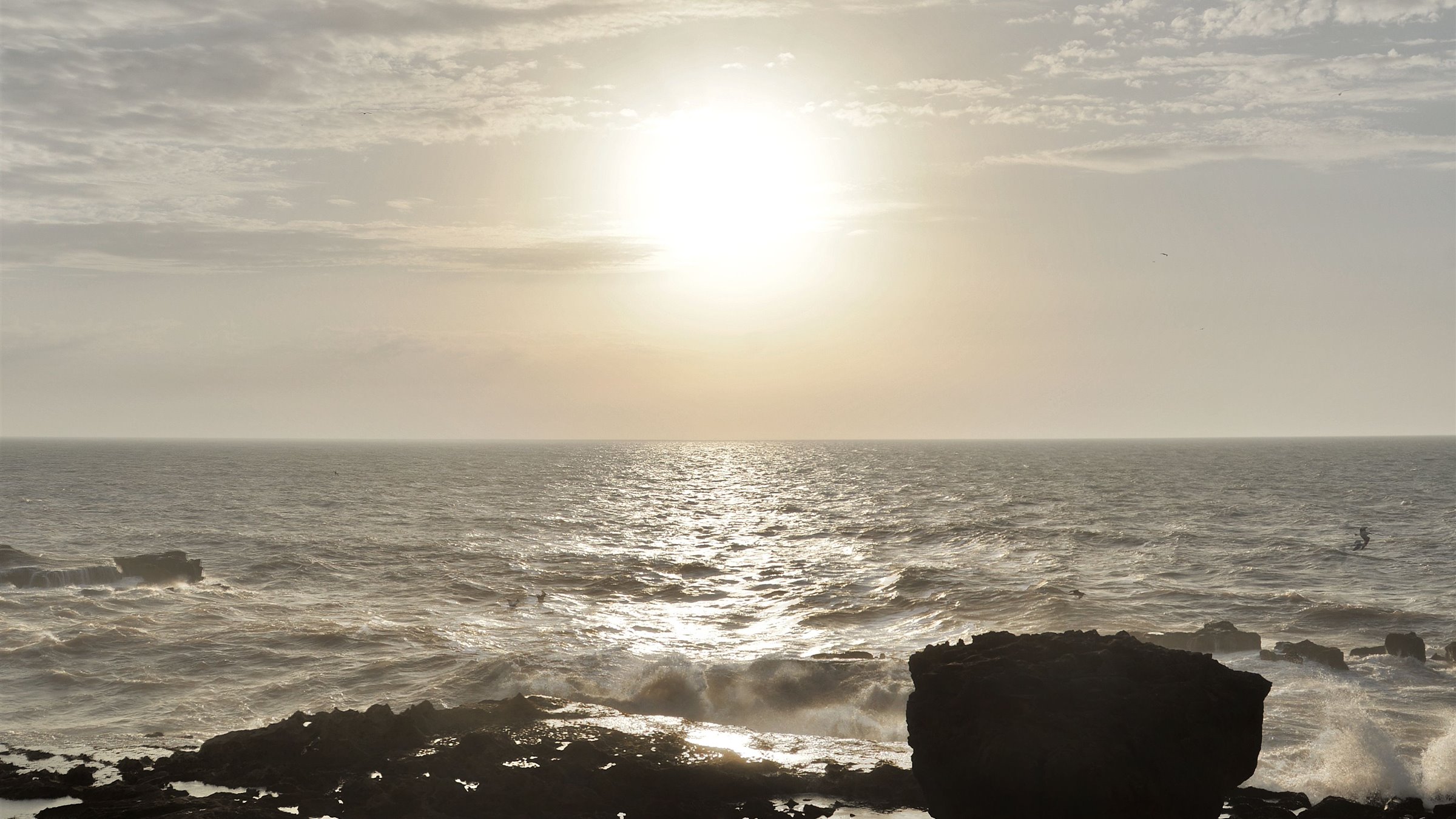 Atlantic waves and rocky shoreline at sunset in Essaouira