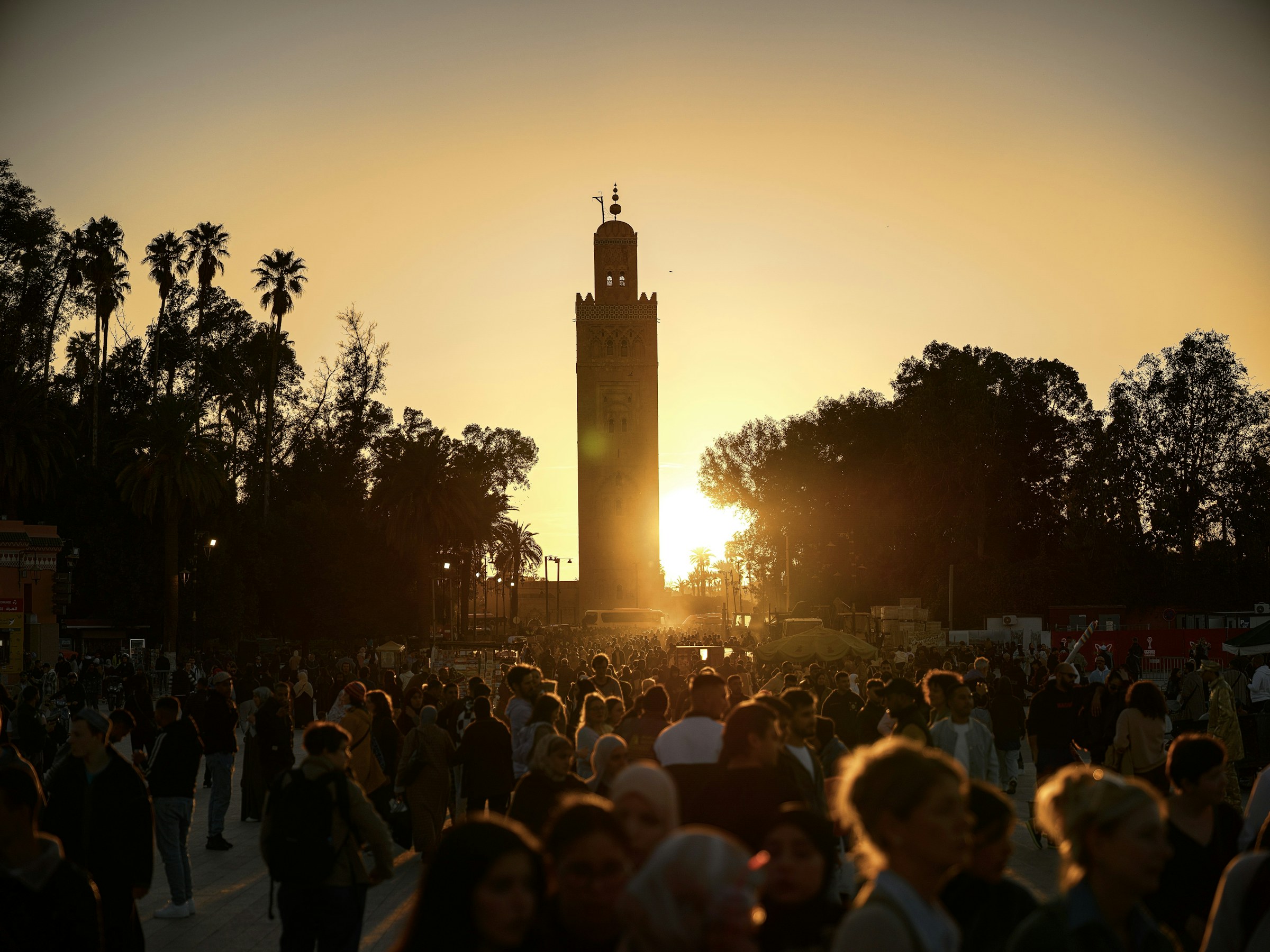 Koutoubia Mosque and Jemaa el-Fnaa glowing at sunset in Marrakech